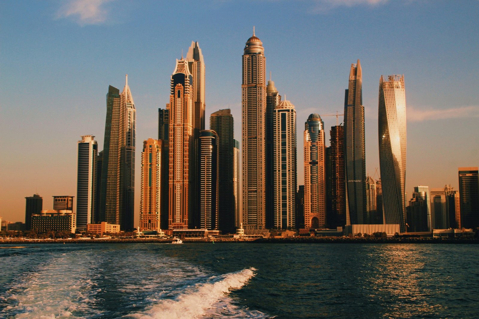 Dubai Marina skyline at sunset, viewed from the water